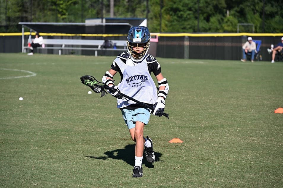 MRL player carrying the ball during field training